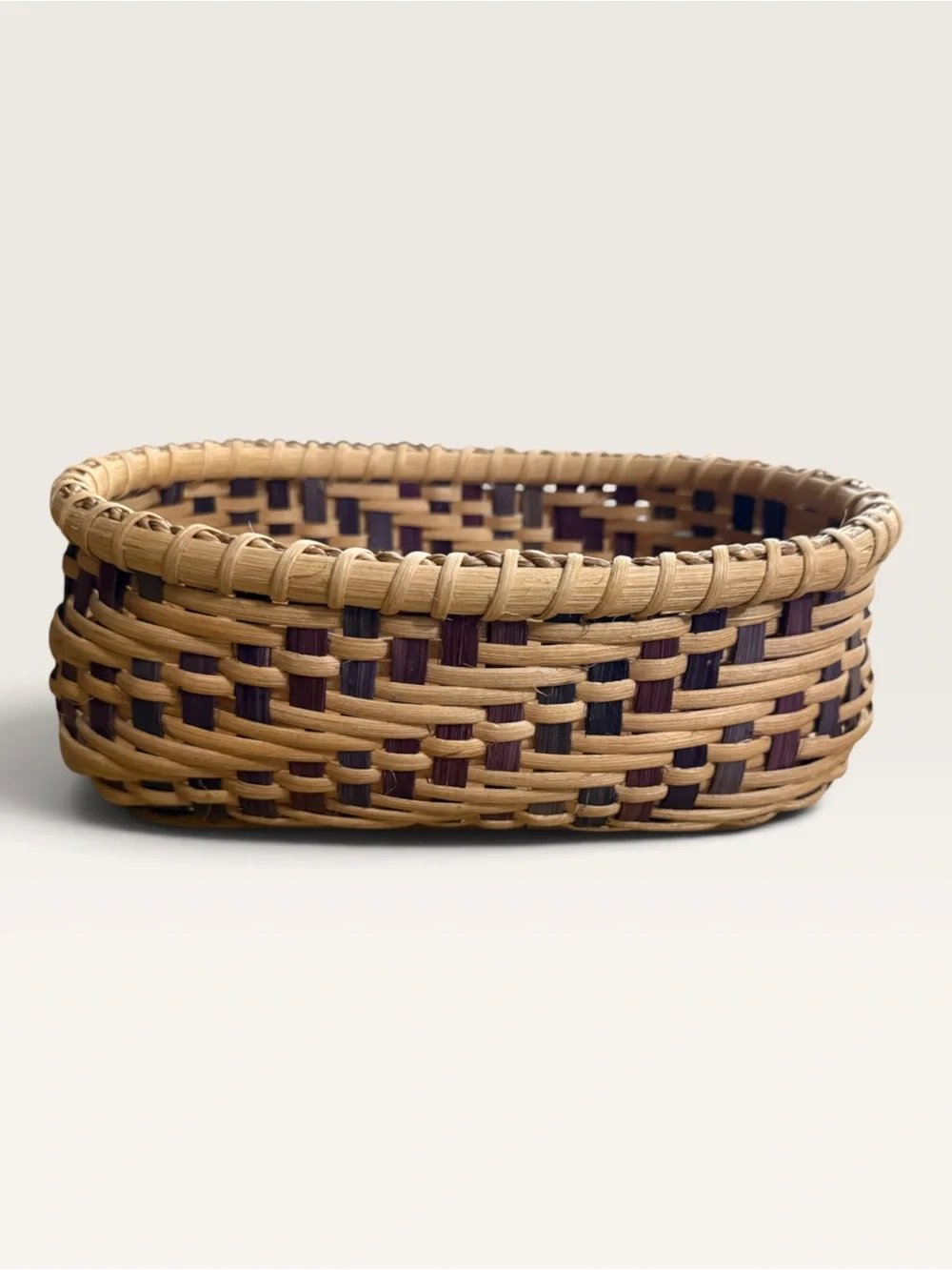 Beautifully Crafted Oval Hand-Woven Reed Basket With Wood Base